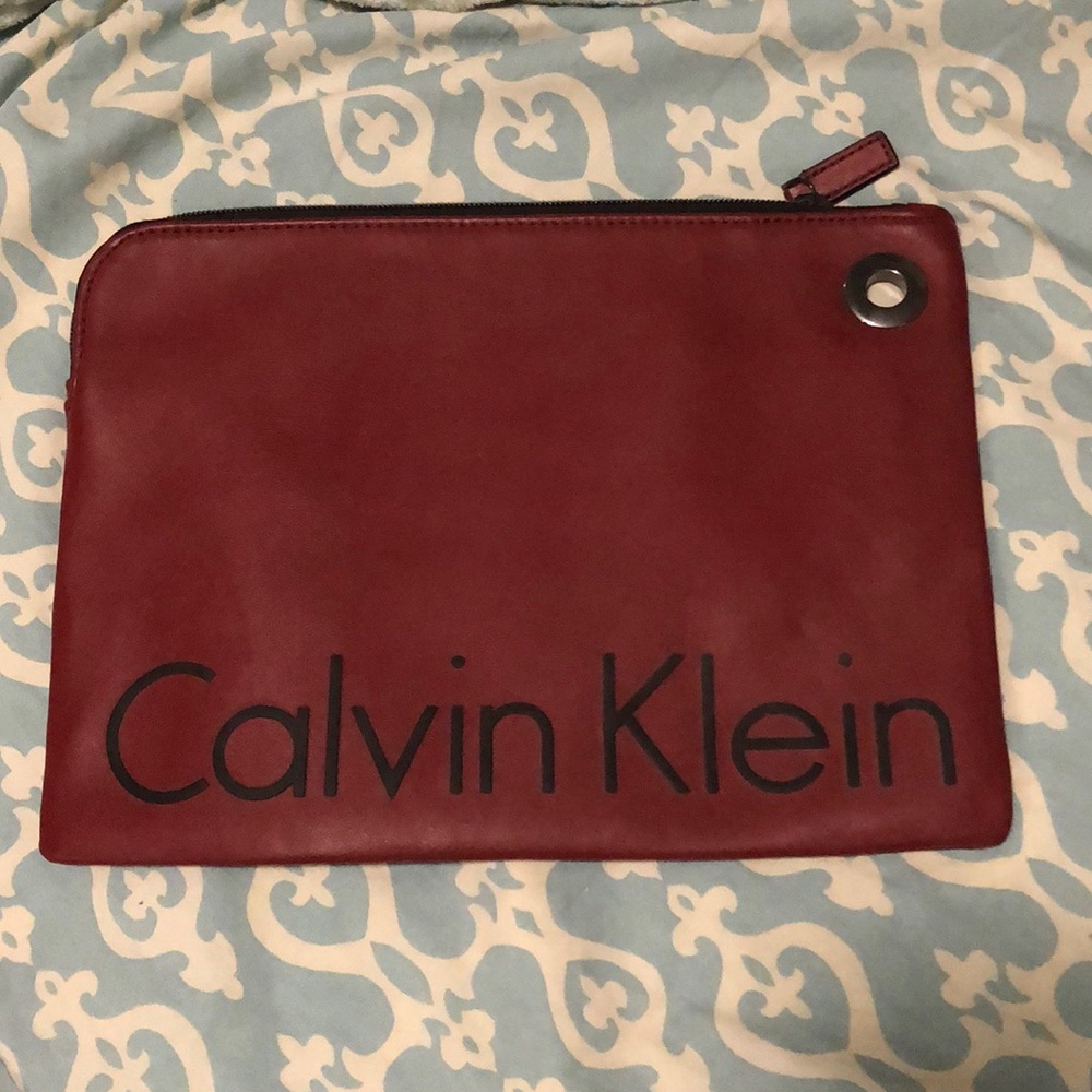 Dark red male or female clutch. Brand new never used. No tags
